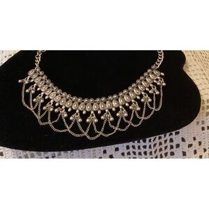 Costume jewelry choker necklace, silver colored metal.  Adjustable length.